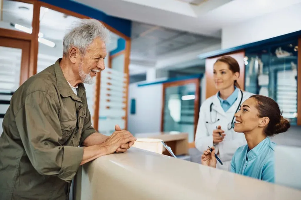 A practitioner with a patient in a treatment room