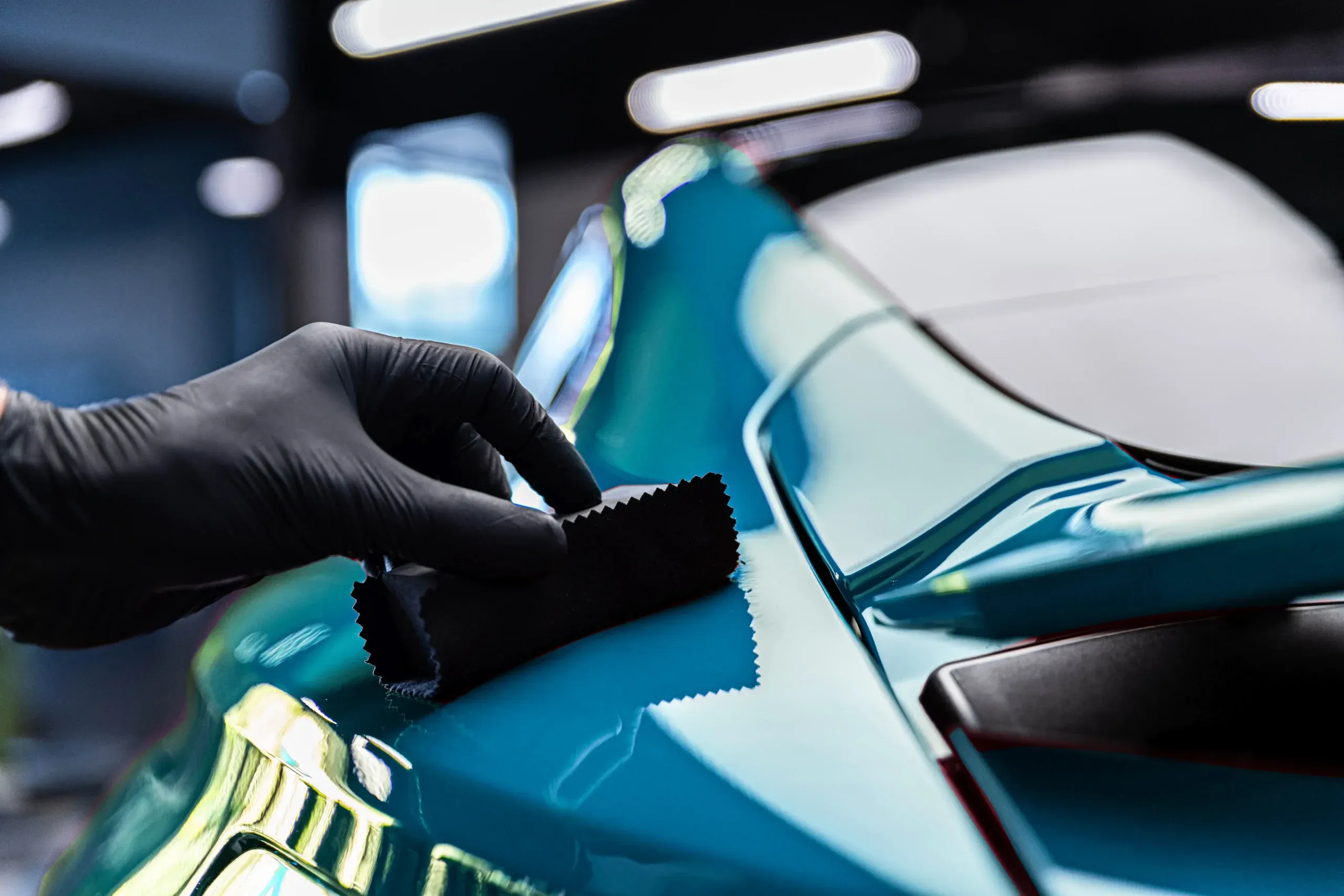 Ceramic coating being applied to a car at Logan’s Auto Detailing
