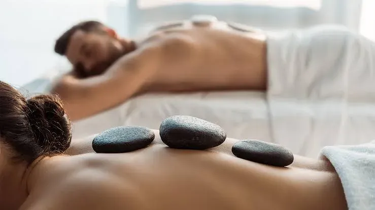 A massage therapist working in a quiet treatment room